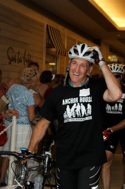 An exhausted but elated Steve Schultz of Princeton crosses the finish line of the Ride for Runaways Saturday. 