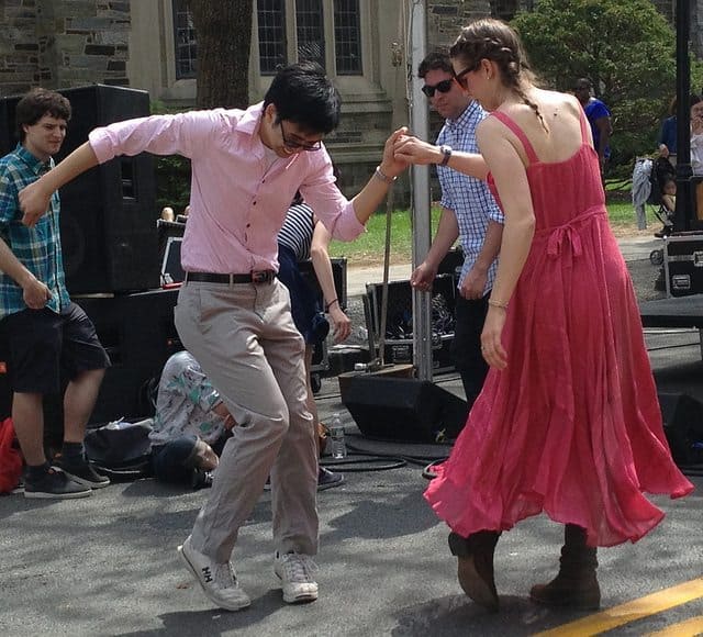 A couple dancing at Communiversity in 2013. Bands will perform on six stages for the 2015 celebration.