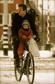 gent and child on bike