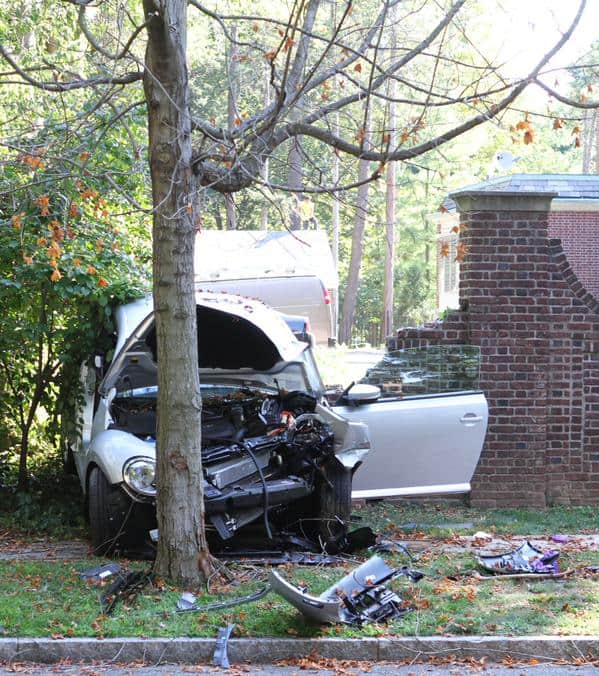 A car crashed into a brick wall on Library place just before 10 a.m. Photo: Seth Callen. 